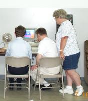 Consumers are learning how to use computers with the help of one of our staff.